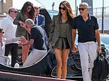 George Clooney helps Amal off water taxi at Venice Film Festival