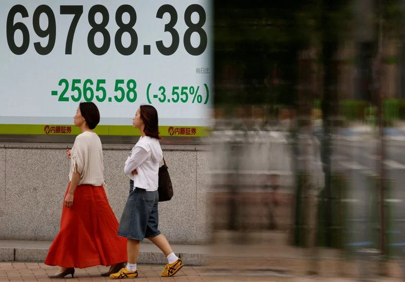 Asian shares slide as US-Iran conflict drives oil and yields higher