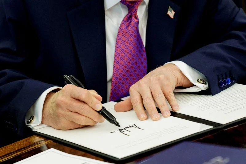 Trump signs funding measure to prevent US shutdown before midterms