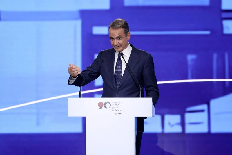 Greek leader sets out income plan before election