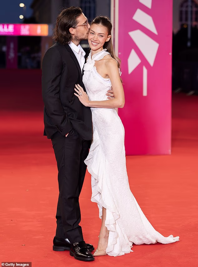 Nicola Peltz dazzles in white as she and Brooklyn honour Dunaway