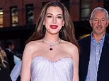 Pregnant Anne Hathaway displays bump at New York Bvlgari show