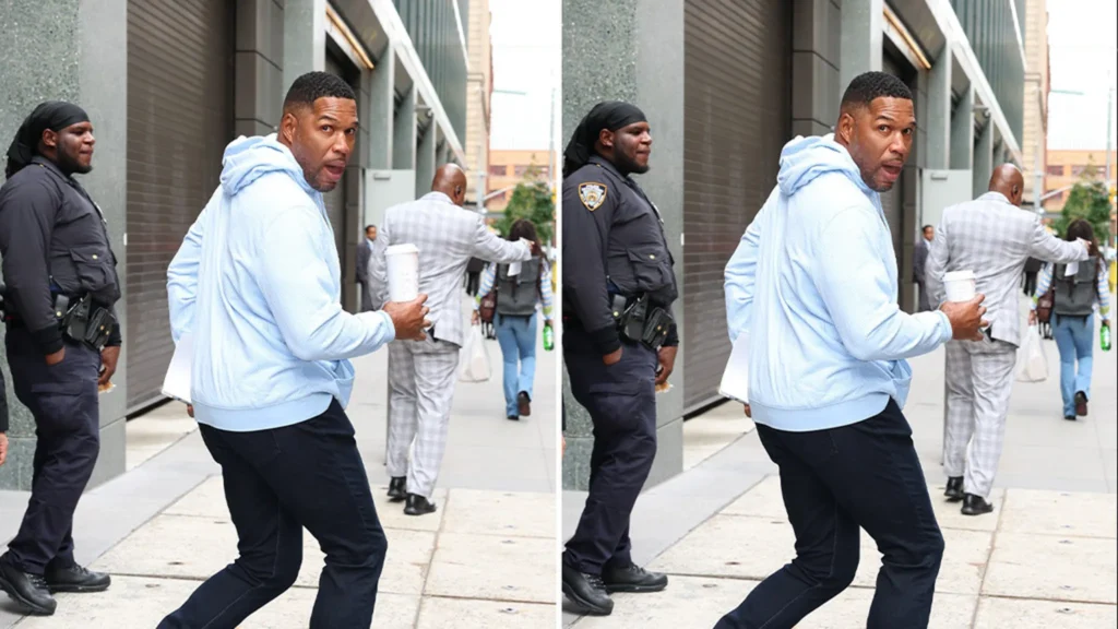 Michael Strahan makes a confident entrance in New York City