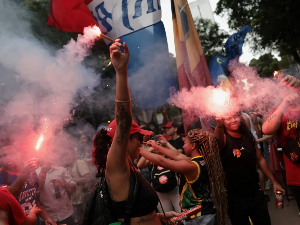 Thousands march in Rio against Bolsonaro and his son