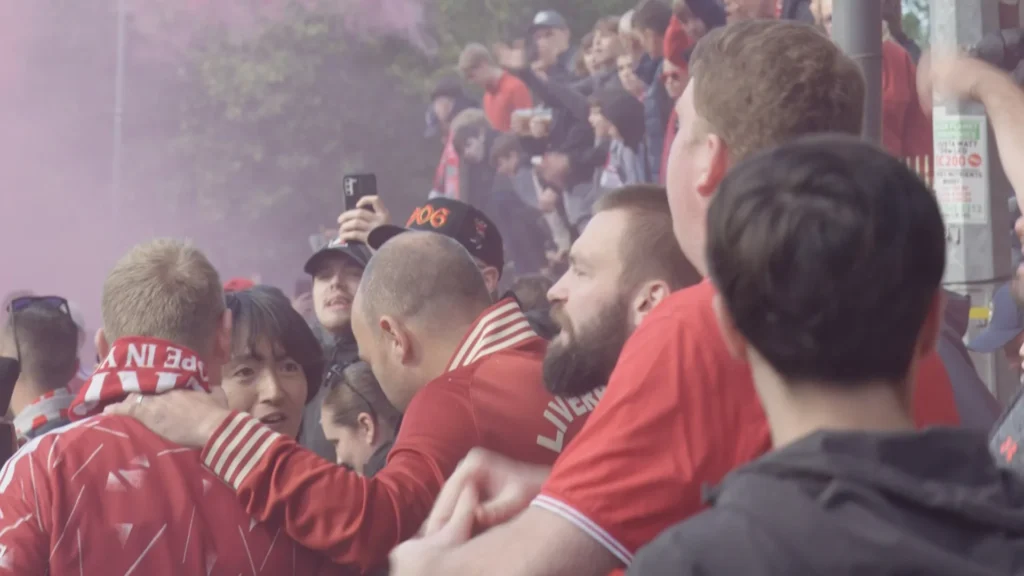 Supporters discuss Manchester City charges before Liverpool clash