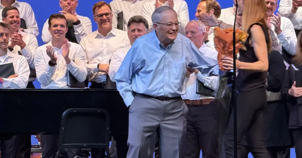 Dozens reunite with 87-year-old choir director for concert