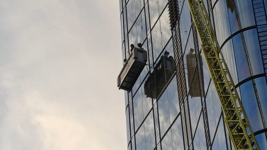 Window cleaners rescued from 15th floor of tall building